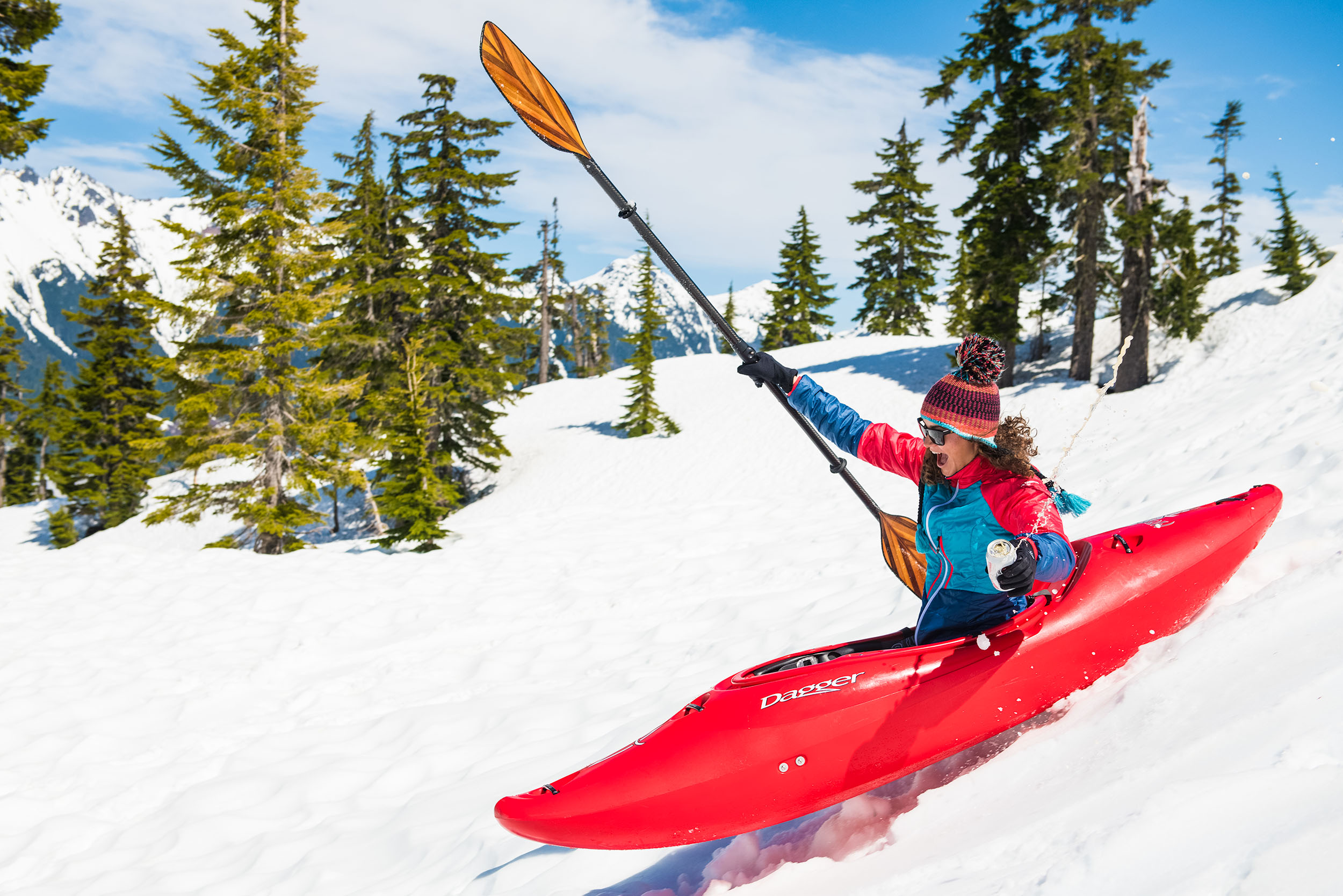 Women snow kayaking, kayaking in snow